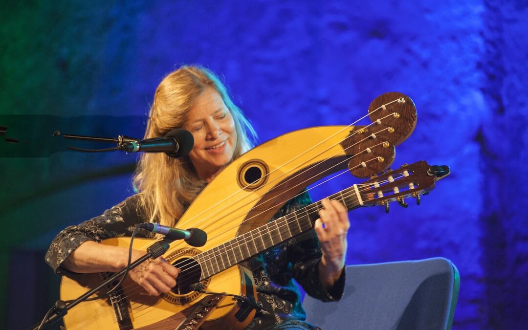 Photo of Murial Anderson with double neck guitar Photo by Buddy Allen